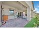 Covered patio featuring comfortable seating, manicured landscaping, and ambient lighting at 444 Middlestone Ave, Henderson, NV 89011