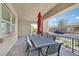 Covered patio with outdoor dining table and chairs with view to the street at 444 Middlestone Ave, Henderson, NV 89011