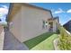 This backyard shows a zero-scaped area and covered patio with additional backyard space at 444 Middlestone Ave, Henderson, NV 89011