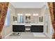 Luxurious bathroom featuring double sinks, granite countertops, and a glass-enclosed shower at 444 Middlestone Ave, Henderson, NV 89011