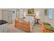 Carpeted bedroom featuring an antique-style bed, decorative furniture, and charming wall decor at 444 Middlestone Ave, Henderson, NV 89011