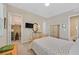 Neutral bedroom featuring a closet, television, decor and bed with patterned bedding at 444 Middlestone Ave, Henderson, NV 89011