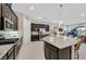 Modern kitchen with granite countertops, stainless steel appliances, and a large island with seating at 444 Middlestone Ave, Henderson, NV 89011