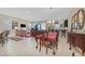 Spacious living room with tile floors, a dining area, and modern lighting fixtures at 444 Middlestone Ave, Henderson, NV 89011