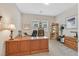 Comfortable office with a large wooden desk, carpet, and windows providing natural light at 444 Middlestone Ave, Henderson, NV 89011