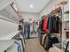 A large walk-in closet with plenty of shelving, hanging space, and room for shoes and accessories at 444 Middlestone Ave, Henderson, NV 89011