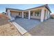 Beautiful backyard features a covered patio, desert landscaping, and ample space for relaxing and entertaining at 4717 S Maddington Ct, Pahrump, NV 89061
