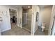 Bathroom featuring patterned tile in the walk in shower and a closet on the left at 4717 S Maddington Ct, Pahrump, NV 89061