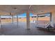 The outdoor living space includes a covered patio and a lounge chair, perfect for relaxation and entertaining at 4717 S Maddington Ct, Pahrump, NV 89061