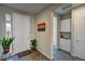 Inviting entryway featuring tiled floors, a large closet, art, and lots of natural light at 4717 S Maddington Ct, Pahrump, NV 89061