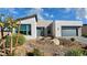 Contemporary residence featuring xeriscaping, a two-car garage, and modern architectural details at 4717 S Maddington Ct, Pahrump, NV 89061