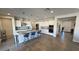 Spacious kitchen features granite counters, stainless appliances, and a large island with bar seating at 4717 S Maddington Ct, Pahrump, NV 89061