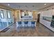 Kitchen island with seating offers views into the rest of the kitchen with stainless appliances at 4717 S Maddington Ct, Pahrump, NV 89061