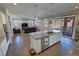 Open kitchen features granite counters, an island with sink, and seamless flow to the living area at 4717 S Maddington Ct, Pahrump, NV 89061
