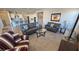 Open-concept living area with a view into the modern kitchen space at 4717 S Maddington Ct, Pahrump, NV 89061