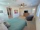 Bright main bedroom has a carpet floor, ceiling fan, and natural light with a closet on the left side at 4717 S Maddington Ct, Pahrump, NV 89061