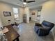 Home office/flex space, featuring an exercise bike, desk, comfy chair, and ample natural light at 4717 S Maddington Ct, Pahrump, NV 89061