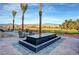 Modern water feature with views of mountains, golf course, and desert landscaping at Mountain Falls in Pahrump, Nevada at 4717 S Maddington Ct, Pahrump, NV 89061