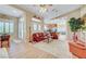 Light-filled living area showcasing an open floor plan with bar seating and a modern kitchen at 4936 Mountain Foliage Dr, Las Vegas, NV 89148