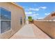 This home includes a spacious backyard that features a cozy patio area with privacy wall at 5031 Droubay Dr, Las Vegas, NV 89122