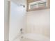 Bright bathroom features a tiled shower with a sleek, modern shower head and an above window at 5031 Droubay Dr, Las Vegas, NV 89122