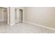 Bedroom with mirrored closet doors, tile floor and doorway to adjacent room at 5031 Droubay Dr, Las Vegas, NV 89122