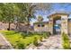 Inviting community park features lush greenery, picnic tables, and a walking path at 5031 Droubay Dr, Las Vegas, NV 89122
