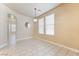 Sunny dining area with neutral walls, tile flooring, and abundant natural light at 5031 Droubay Dr, Las Vegas, NV 89122