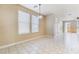 Open dining room area featuring tile flooring, bright windows, and contemporary lighting at 5031 Droubay Dr, Las Vegas, NV 89122