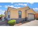 Charming single-story home featuring a tile roof, neutral stucco, and a two-car garage at 5031 Droubay Dr, Las Vegas, NV 89122