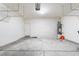 Spacious garage with overhead storage racks and a water heater at 5031 Droubay Dr, Las Vegas, NV 89122