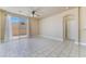 Inviting living room featuring tile floors and sliding glass doors to the backyard at 5031 Droubay Dr, Las Vegas, NV 89122