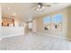 Bright living area with large windows, tile flooring, and an open floor plan at 5031 Droubay Dr, Las Vegas, NV 89122