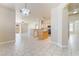 Bright open floorplan featuring tile flooring, kitchen, and access to the backyard at 5031 Droubay Dr, Las Vegas, NV 89122