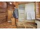 A unique bathroom features full wood accents, a glass shower, and a separate toilet room at 55 Siddall Ave, Las Vegas, NV 89183