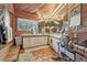 A bathroom features lots of natural light, a double sink vanity, and wood accents at 55 Siddall Ave, Las Vegas, NV 89183