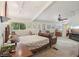A bedroom features a ceiling fan, windows, a door to the exterior, and a cozy sitting area at 55 Siddall Ave, Las Vegas, NV 89183