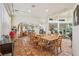 A large dining room leads to many parts of the house with a breakfast nook and living room in view at 55 Siddall Ave, Las Vegas, NV 89183