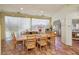 The large dining room has lots of light with many windows and views to the other parts of the home at 55 Siddall Ave, Las Vegas, NV 89183