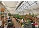 Greenhouse interior with many potted plants and shelving with gardening supplies at 55 Siddall Ave, Las Vegas, NV 89183