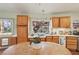 Functional kitchen with ample counter space, wood cabinets, and a cozy breakfast table at 55 Siddall Ave, Las Vegas, NV 89183