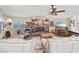 Bright living room with brick fireplace and large windows, creating a warm and inviting space at 55 Siddall Ave, Las Vegas, NV 89183