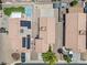 High angle view of houses with desert landscaping, solar panels, and inground pools at 5550 Ramirez St, North Las Vegas, NV 89031