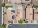 Overhead aerial view of homes with desert landscaping, solar panels and pools at 5550 Ramirez St, North Las Vegas, NV 89031