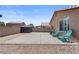 Spacious backyard featuring a concrete patio, rock landscaping, and storage shed at 5550 Ramirez St, North Las Vegas, NV 89031
