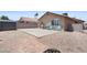 Backyard patio area with desert landscaping and partial shade at 5550 Ramirez St, North Las Vegas, NV 89031