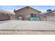 Backyard patio with space for entertaining featuring desert landscaping and shade at 5550 Ramirez St, North Las Vegas, NV 89031