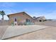 Spacious backyard with patio area, gravel landscaping, and privacy fence at 5550 Ramirez St, North Las Vegas, NV 89031