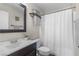 Cozy bathroom with a shower and dark wood vanity with a white countertop and fresh decor at 5550 Ramirez St, North Las Vegas, NV 89031