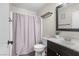 Cozy bathroom with a shower and dark wood vanity with a white countertop and fresh decor at 5550 Ramirez St, North Las Vegas, NV 89031